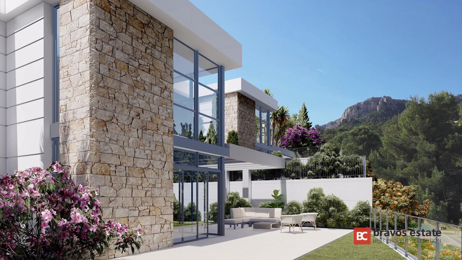 Stone and glass facade of a two-storey villa with terrace