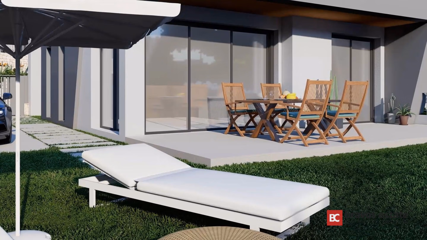 CGI render of a Bonalba Green Villas detached villa showing a ground-floor terrace with teak dining set, sunlounger on lawn, and large sliding glass doors.