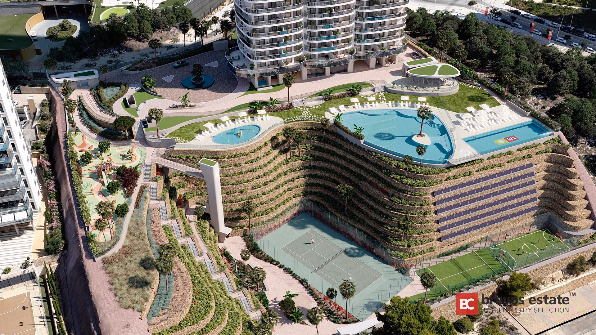 Render aéreo de TM Tower en Playa de Poniente con muros aterrazados, piscinas de forma orgánica, pistas deportivas y paneles solares